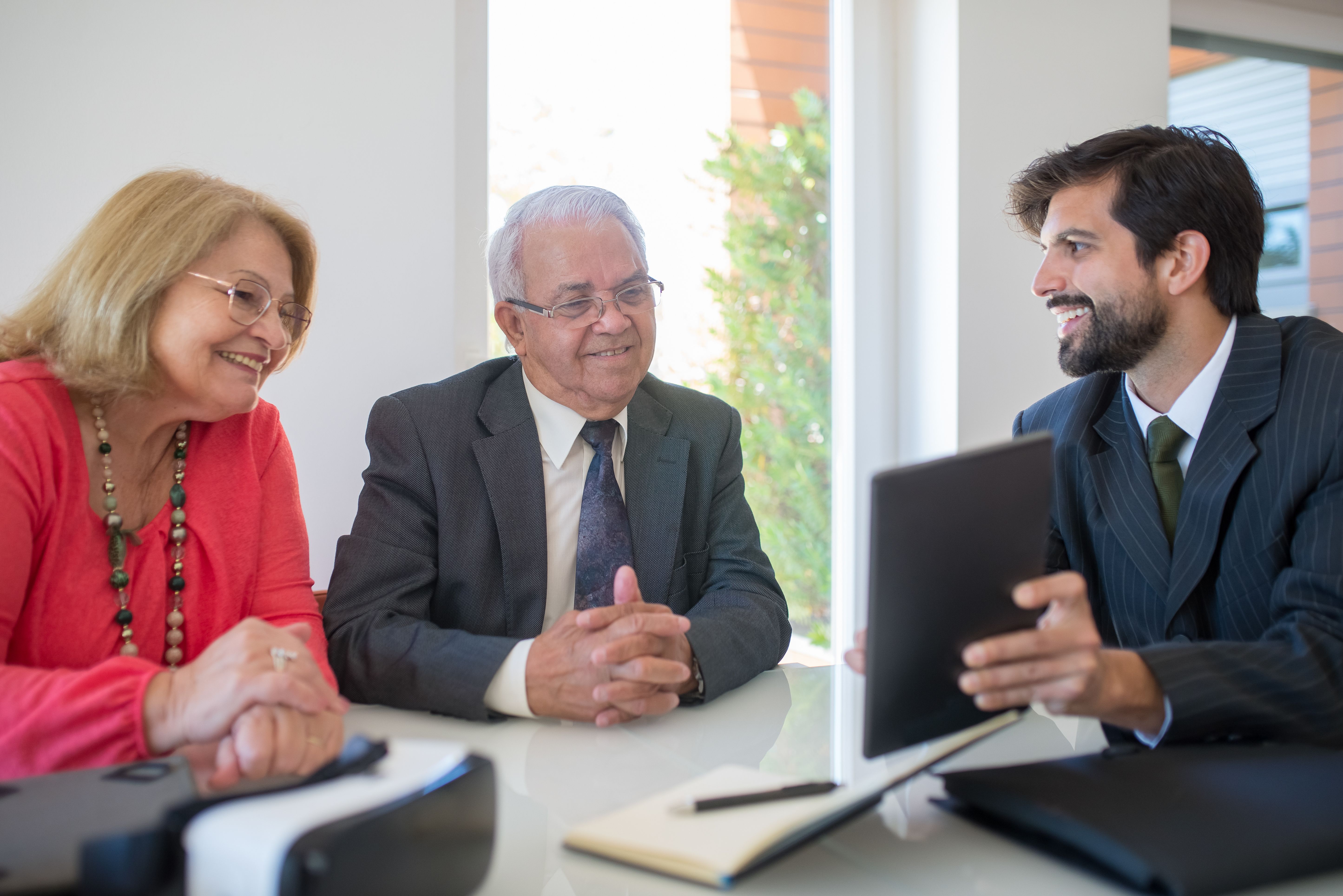 A financial adviser discussing a wealth plan with clients